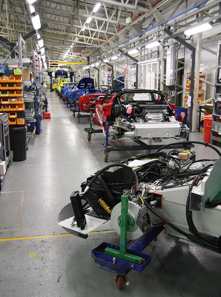 Partially assembled car on an assembly line